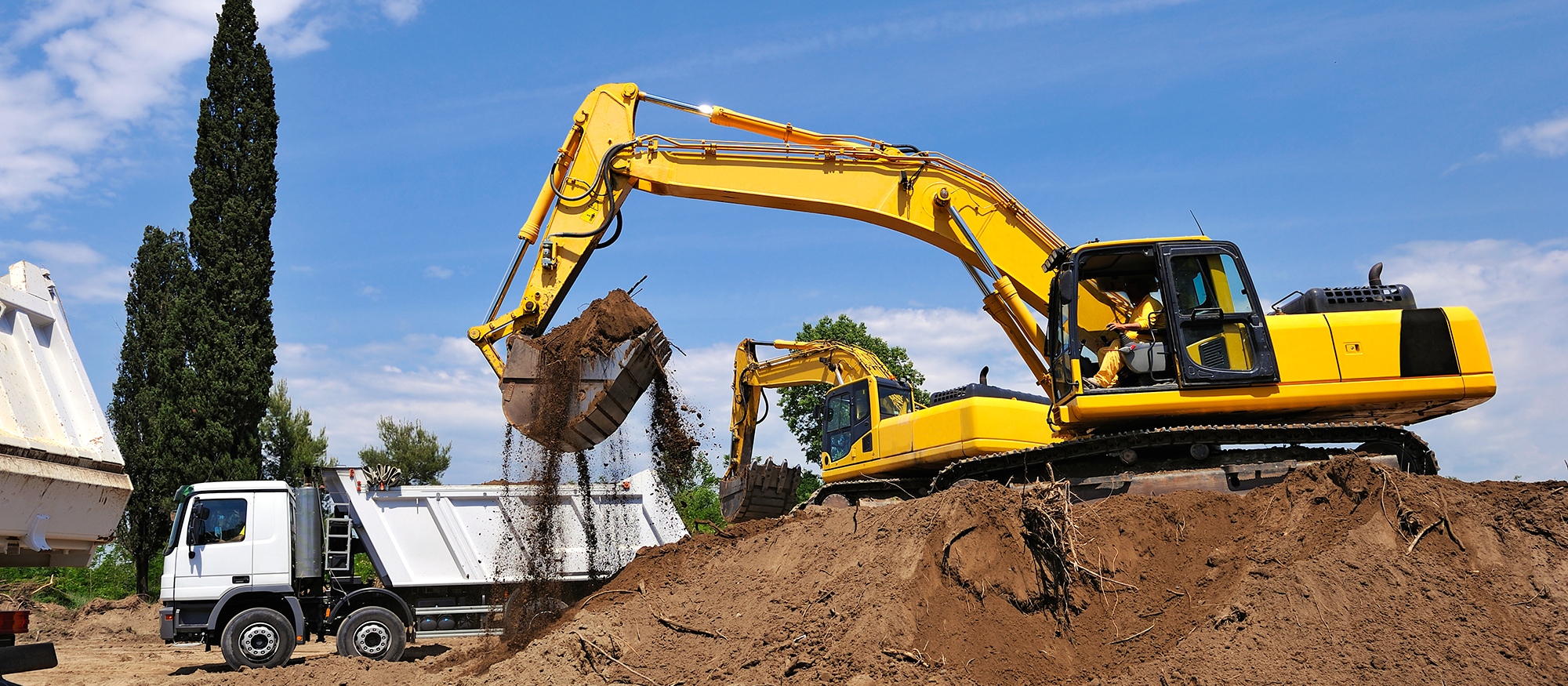 Zdjęcie przedstawia koparkę